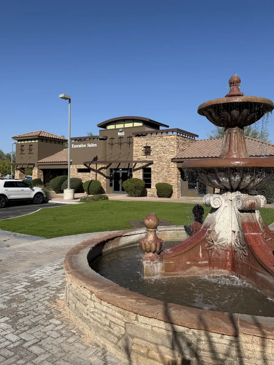 Executive Suites building at 9855 S Priest Dr in Tempe, with fountain in front